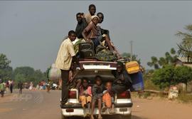 A car full with people and their belongings in the PK 9 district flee from Bangui 