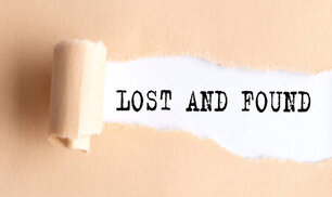 The text LOST AND FOUND appears on a torn paper on white background.