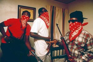 Gang activity three guys wearing red bandanas and holding guns