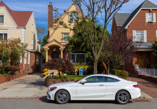 Mercedes-Benz Coupe parked on the street in Bay Ridge, Brooklyn, New York, USA. Trees, Road and Sidewalk are in the image. Canon EOS 6D (full frame sensor) DSLR and Canon EF 24-105mm f/4L IS lens.